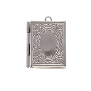 Detailed view of silver stainless steel book-shaped locket pendant with embossed patterns