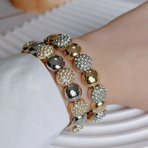 Fashionable layered gold and silver beaded bracelet set with sparkling zircon pavé beads