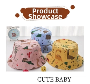 Detailed display of three cartoon dinosaur baby bucket hats in pink, blue, and yellow