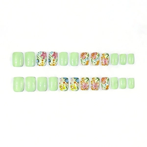 Short square press-on nails with light green finish and colorful floral art design
