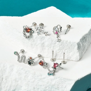 Surgical steel threadless labret studs with heart, cross, and animal zircon charms