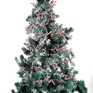 Christmas tree decoration string with red and white candy canes and realistic faux snow