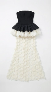 Detailed view of 3D floral petals on a semi-transparent mesh mermaid dress skirt