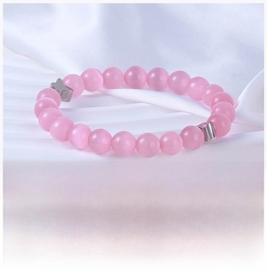 Detail of pink cat-eye stone beads and titanium steel butterfly charms on a sweet bracelet