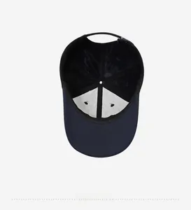 Detailed interior of a navy baseball cap featuring 6-panel stitching and metal buckle