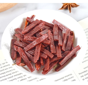 Macro detail of miniature PVC dried beef jerky strips with chili and star anise for dollhouse