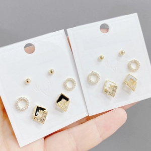 Detailed close-up of S925 silver post earring set with inlaid zircon in gold finish