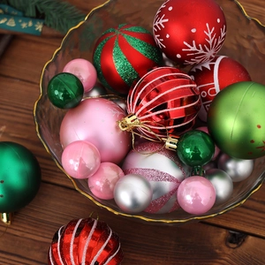 Assorted Christmas ball ornaments in festive red, green, and silver for tree decoration