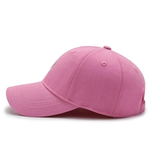 Pink cotton baseball cap with R letter embroidery shown from a side view on white background