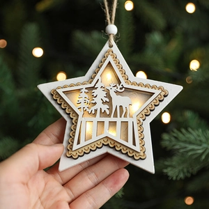 Luminous wooden star Christmas ornament with reindeer carving and warm LED light