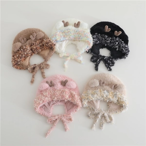 Plush winter earflap hat for kids featuring cute antlers and windproof chin straps