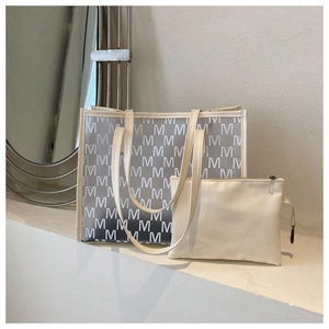 Close-up of cream large capacity transparent tote bag with matching inner zipper pouch