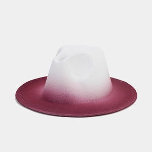 Detailed close-up of wool fedora hat showing smooth white to burgundy color gradient