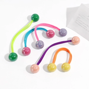 Detailed shot of vibrant elastic hair ties featuring colorful double resin beads