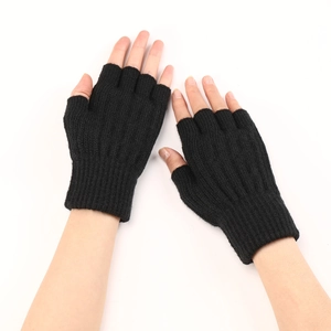 Close-up of black cable knit fingerless gloves showcasing warm knit texture and soft material