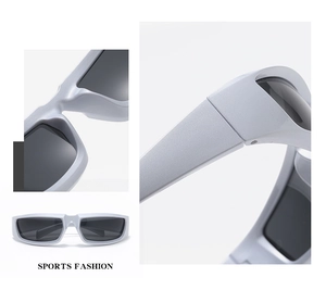 Detail view of silver sports fashion sunglasses featuring matte frames and dark grey lenses