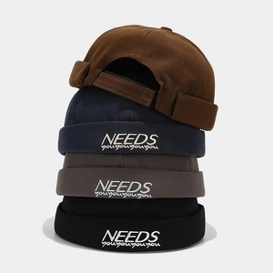 Streetwear cotton docker hats with NEEDS embroidery in brown, navy, grey, and black colors