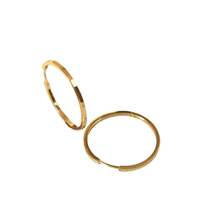 Pair of large gold S925 silver hoop earrings with textured geometric facets