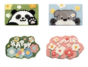 Detailed view of assorted fluffy bath mats with panda, dog, and floral cartoon patterns