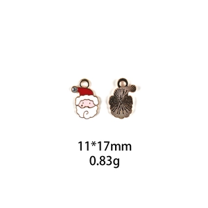 Front and back detail of enamel Santa Claus charm with rhinestone and gold-tone finish