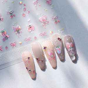 Pink strawberry nail stickers with butterfly bow designs and sparkling crystal rhinestones