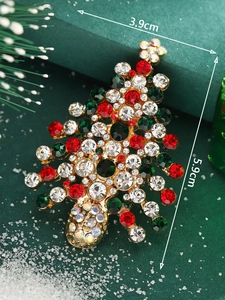 Detailed macro view of a 5.9cm Christmas tree brooch with colorful rhinestones