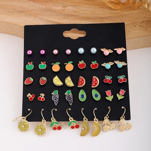 Detail of 20 pairs alloy earring set featuring fruit and floral enamel designs on black card