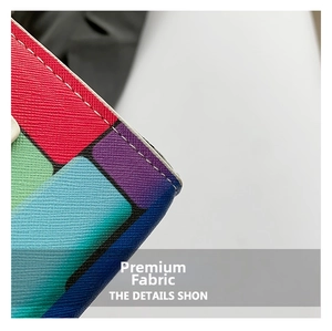 Close-up of Saffiano leather texture with colorful geometric patterns and white stitching