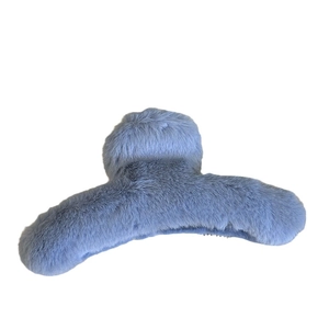 Light blue plush faux fur hair claw clip for elegant women styling in autumn and winter