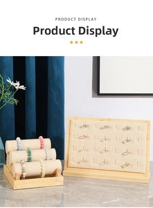 Linen jewelry display stand featuring a three-tier bracelet holder and ring insert tray