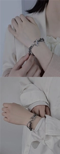 Detailed view of double-layer titanium steel bracelet featuring a secure OT clasp design