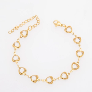Gold plated titanium steel bracelet with heart shaped clear glass stones and lobster clasp