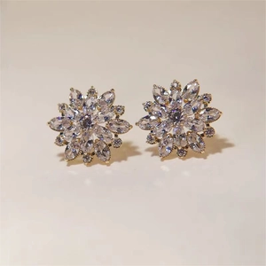 Elegant gold flower stud earrings with sparkling clear cubic zirconia crystals