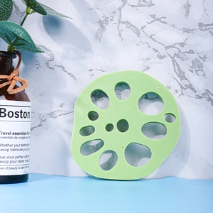 Detailed view of light green lotus root shaped silicone coaster with heat resistance