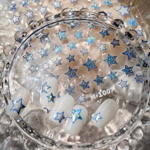 Blue laser star nail stickers M-1007 on silver sand finish with shiny gold accents