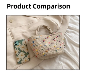 Detailed view of beige woven bucket bag with colorful pom-pom embroidery and phone for size