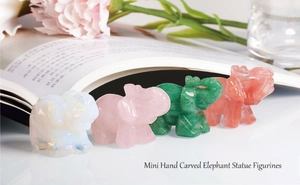 Group of four mini hand-carved crystal elephant figurines in opal, rose quartz and jade
