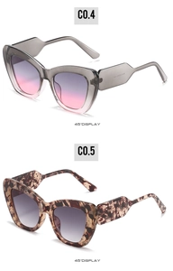Detailed 45-degree side view of grey translucent and tortoiseshell cat eye sunglasses
