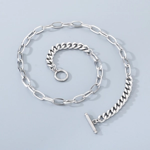 Close-up of dual-chain silver necklace with stylish OT toggle clasp and mixed links