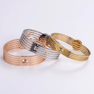 Minimalist cutout diamond-pattern stainless steel bangles in gold, silver, and rose gold