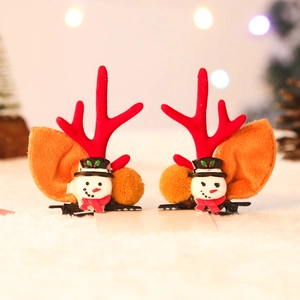 Detail view of festive reindeer antler hair clips with snowman and fuzzy brown ears