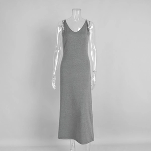 Detail of grey V-neck knitted maxi dress showing fabric drape and slim fit cut