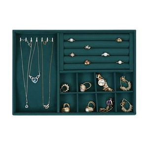 Dark green velvet jewelry tray with necklace hooks and ring slots for display