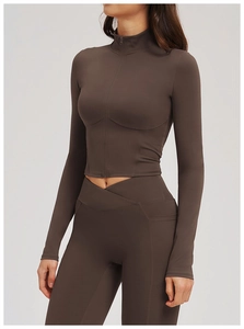 Detail view of coffee brown yoga set with zip-up jacket and cross-waist pocket leggings