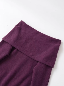 Detail of plum purple ribbed knit off-shoulder sweater with high-quality fabric texture