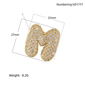 Chubby letter M pendant in copper with pavé zircons, dimensions 27mm by 25mm