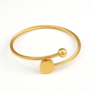 Minimalist gold braided stainless steel open bangle with bead and flat disk accent