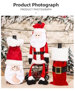 Three festive Christmas velvet wine bottle covers with Santa motifs on a rustic background