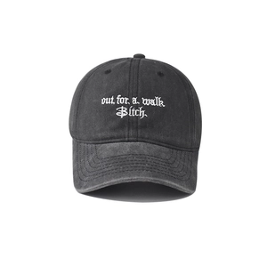 Macro view of gothic embroidery on vintage washed cotton baseball cap texture