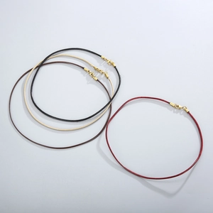 Detailed view of colorful wax cord necklaces with gold stainless steel lobster clasps